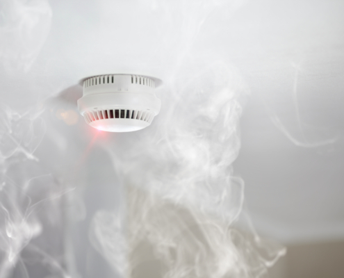 Smoke detector mounted on roof in apartment