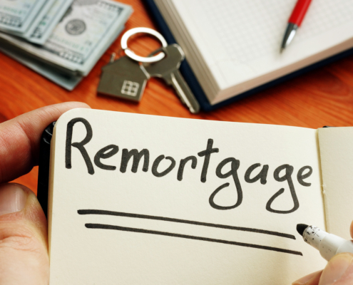 Remortgage handwritten word by man.