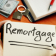 Remortgage handwritten word by man.