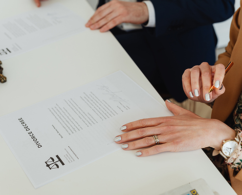 Two People looking at documents at a desk