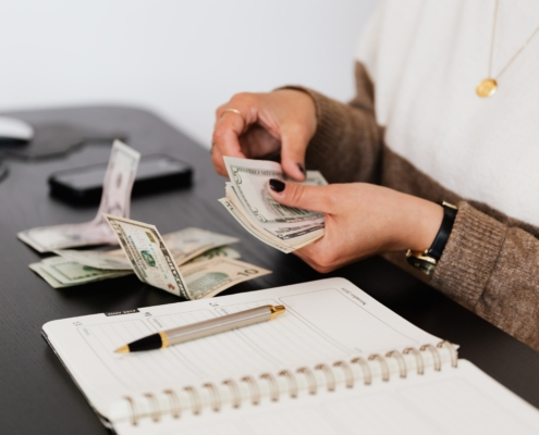 Person counting cash notes