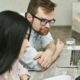 A man and a woman looking at a laptop