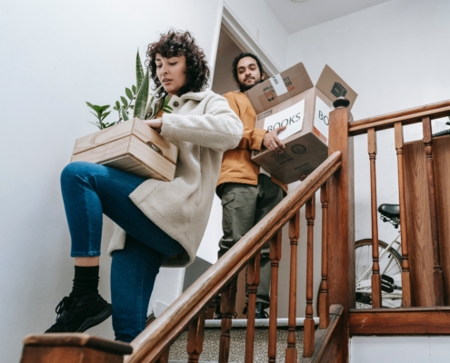 2 People carrying boxes