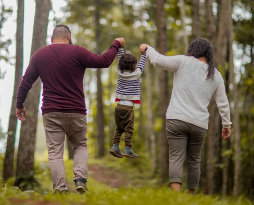 A family walking in a forest