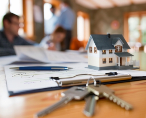 Concept for selling a house and home insurance. Signing a house purchase and sale agreement, housing rental, property insurance. key, house, mortgage, real estate, rent, selling, loan, property, agent