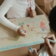 Two children drawing on paper
