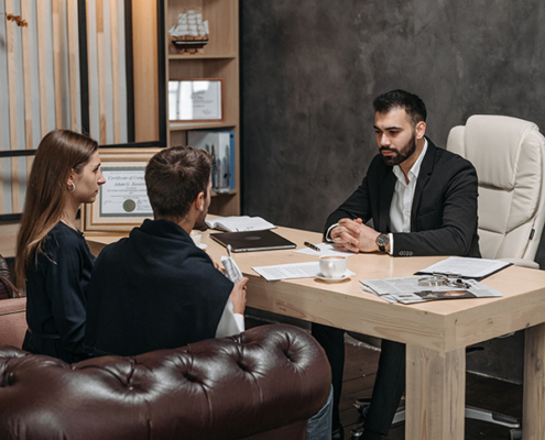 Two people talking to social services