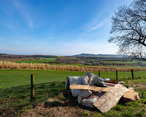 Fly Tipping Christmas Tree, Double Mattress, Timber, Furniture, Carpets and General Household Waste in a Beautiful Scenic Rural Area over looking Farms and