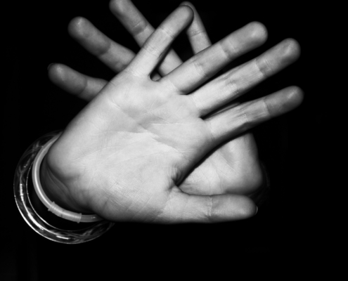 Someone's hands crossing