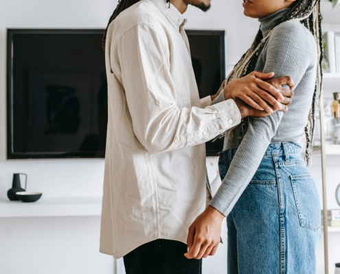 A couple talking in a living room