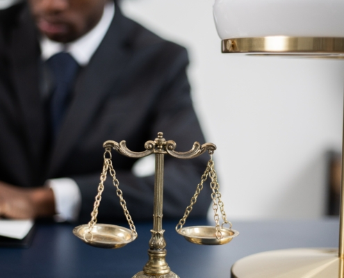 Brass Colored Balance Scale on a Lawyer's Table