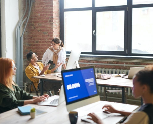 Two people talkign in an office