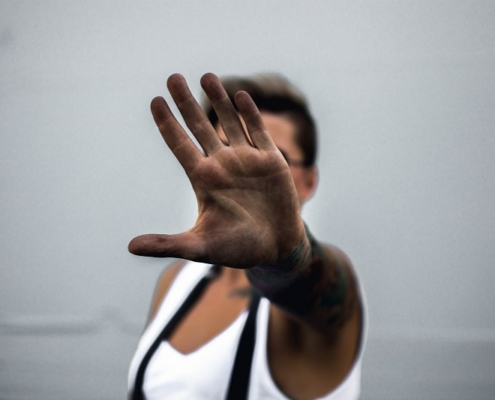 Man holding hand covered in dirt in front of camera