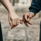 Two people holding hands