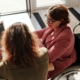 Two people talking at a desk