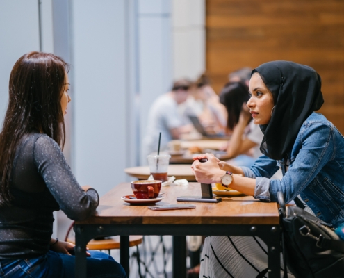 Two people talking to one another