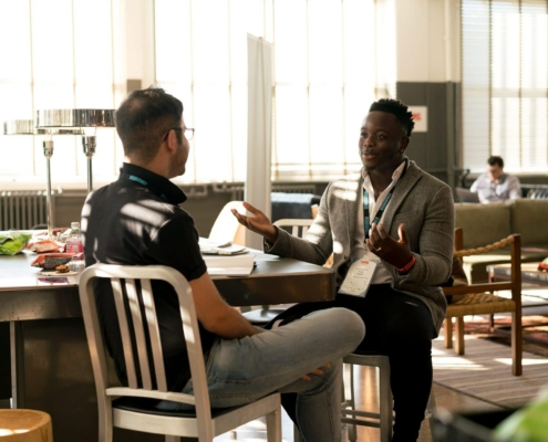 Two men talking at a table