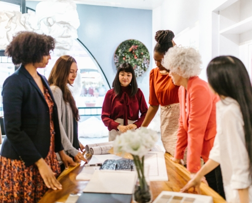 6 Women looking at a table